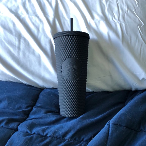 A black studded Starbucks tumbler